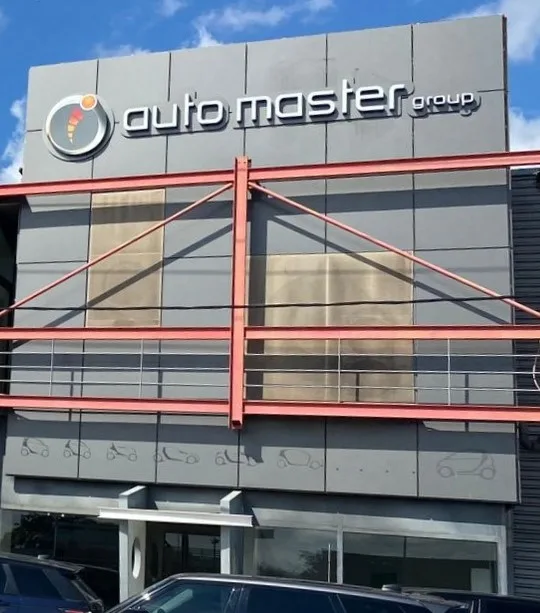 Exterior of the Auto Master Group Kifisia branch, with the workshop sign.