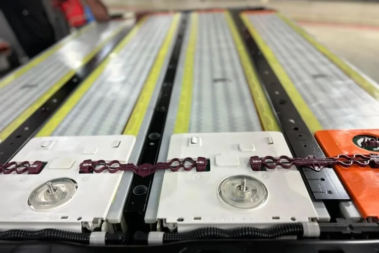 An opened Tesla Model 3 high-voltage battery from an Auto Master Group repair case.