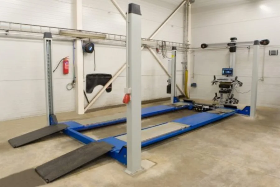 A lift in an Autoks Autokeskus work bay, shown in the company gallery.